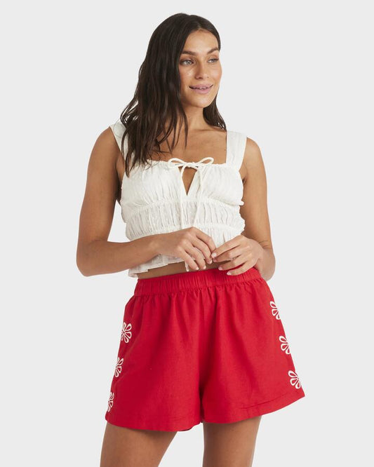 Image of a model wearing Shorts. Productname: Roxy - Womens Chase Elastic Waist Shorts - Rio Red - in Rio Red colour by brand - Roxy