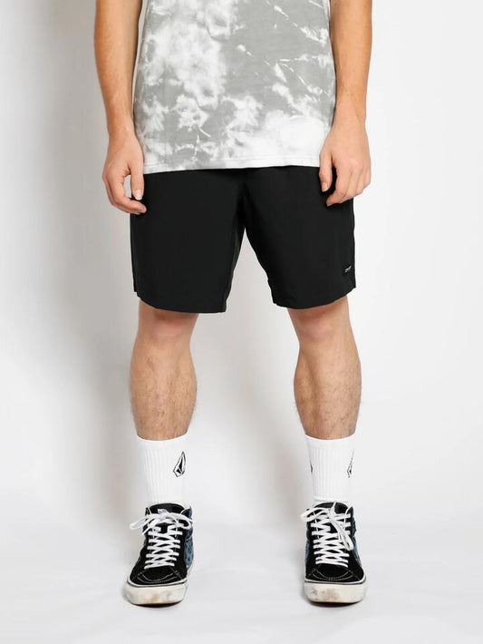 Image of a model wearing Shorts. Productname: Volcom Mens Stones 18" Hybrid Shorts Black - in Black colour by brand - Volcom
