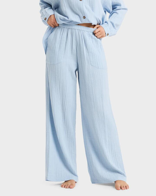 Image of a model wearing Pants. Productname: Roxy - Womens What A Vibe Track Pants - Kentucky Blue - in Kentucky Blue colour by brand - Roxy