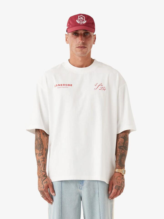 Image of a model wearing Tops. Productname: Zanerobe Fresh Produce Flow Tee in Vintage White colour by brand - Zanerobe