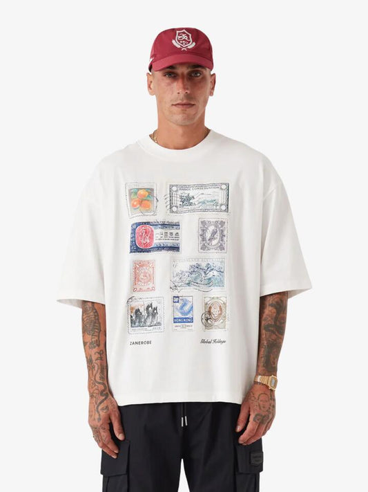 Image of a model wearing Tops. Productname: Zanerobe Stamps Flow Tee in Vintage White colour by brand - Zanerobe