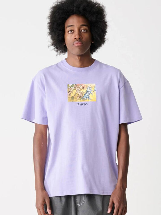 Image of a model wearing Shorts. Productname: Xlarge Challenge Short Sleeve Tee in Lavender colour by brand - Xlarge
