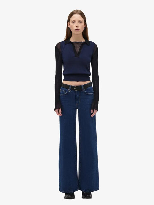 Image of a model wearing Denim. Productname: Neuw Eva Wide Indigo Muse in Mid Indigo colour by brand - Neuw