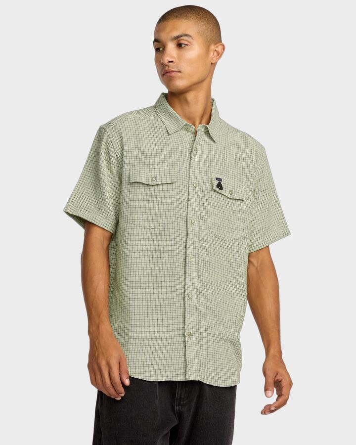 Image of a model wearing Tops. Productname: RVCA - Mens Ksl Yarn Dye Short Sleeve Shirt - Silver Bleach - in Silver Bleach colour by brand - RVCA