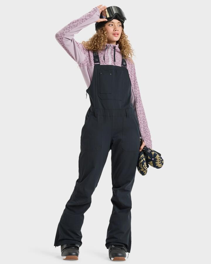 Image of a model wearing Pants. Product name - Roxy Womens Rideout Bib Snow Pants True Black in True Black colour by brand - Roxy