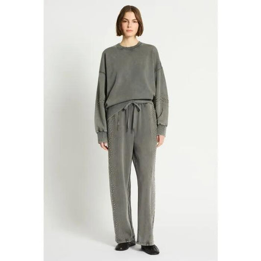 Image of a model wearing Outerwear. Productname: Raceway Embellished Sweatshirt in Acid Wash colour by brand - sass and bide