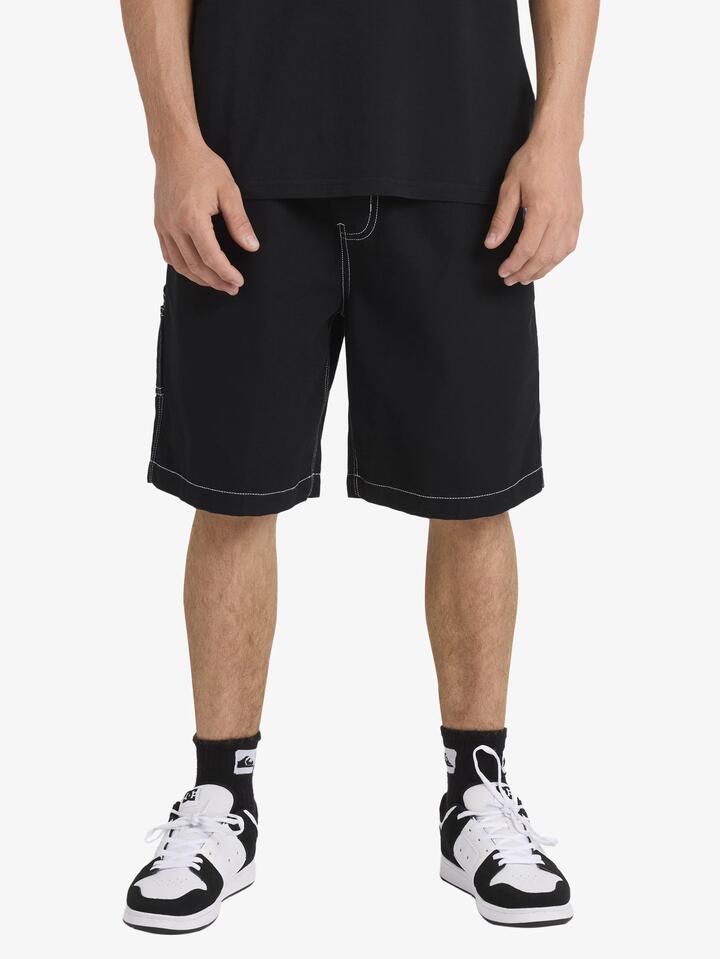 Image of a model wearing Shorts. Product name - Quiksilver Mens Toned Down Walkshorts Black in Black colour by brand - Quiksilver