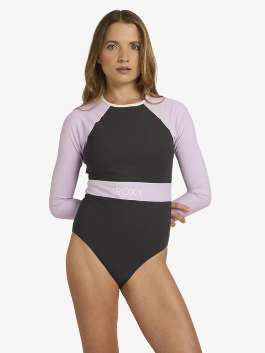 Image of a model wearing Tops. Productname: Roxy Womens Roxy Active Long Sleeve One Piece Black Multi - in Black Multi colour by brand - Roxy