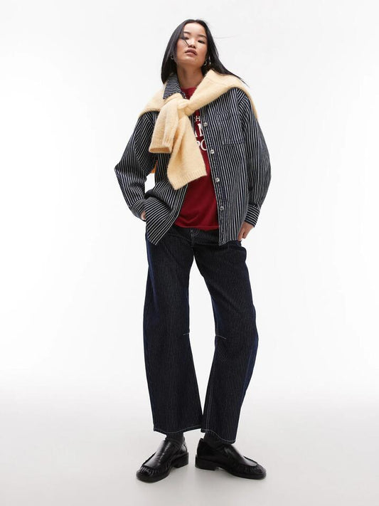Image of a model wearing Denim. Productname: Topshop Mid Rise Barrel Jeans in Indigo Stripe colour by brand - Topshop