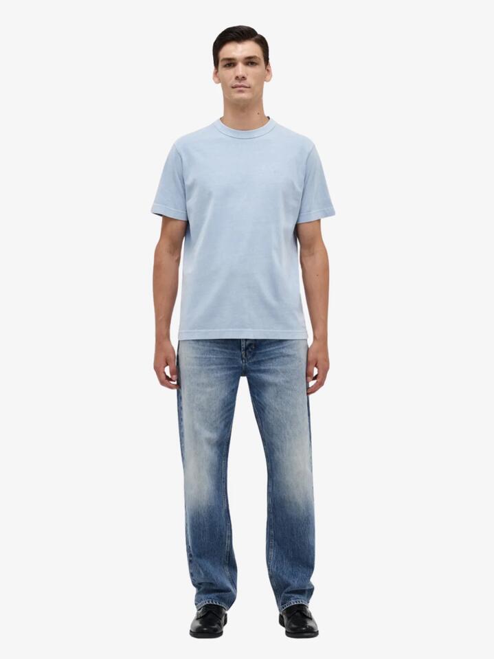 Image of a model wearing Denim. Productname: Neuw Liam Loose Rio in LIGHT INDIGO colour by brand - Neuw