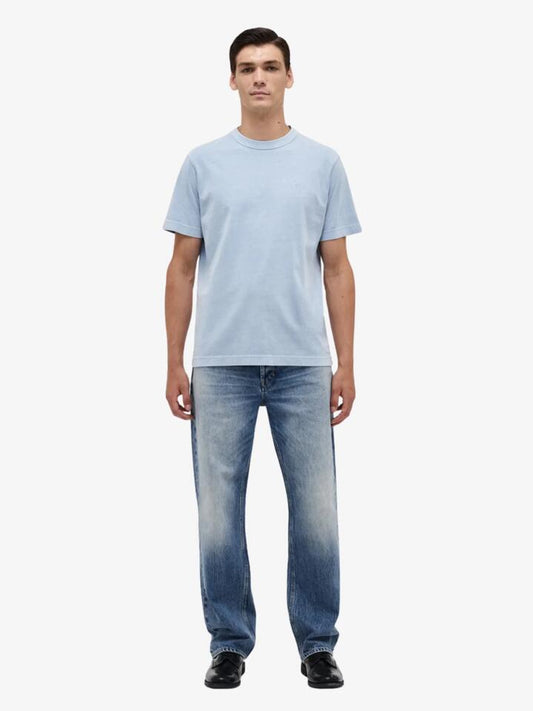 Image of a model wearing Denim. Productname: Neuw Liam Loose Rio in LIGHT INDIGO colour by brand - Neuw