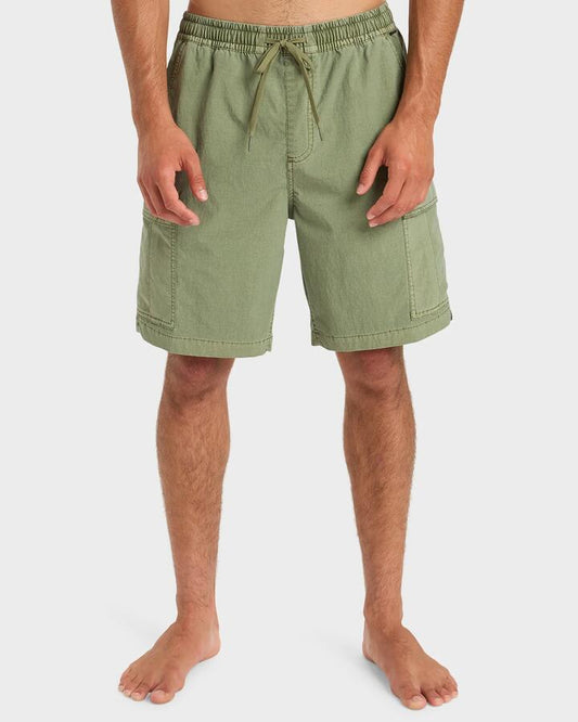 Image of a model wearing Shorts. Product name - Quiksilver Mens Taxer Surfwash 19" Hybrid Shorts Loden Green in Loden Green colour by brand - Quiksilver