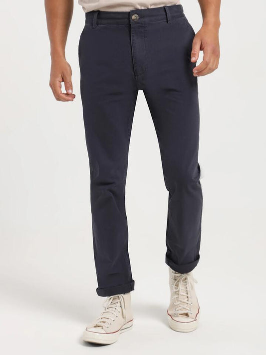Image of a model wearing Pants. Productname: Article One Ellis Chino Pant in Navy colour by brand - Article One