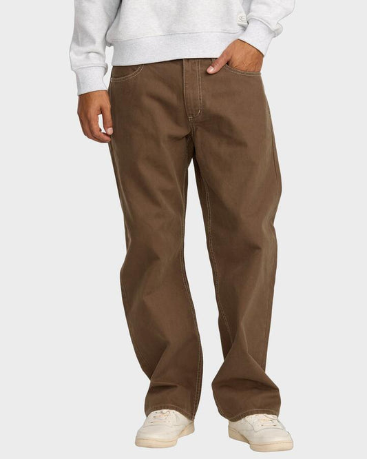 Image of a model wearing Pants. Productname: RVCA Mens Dayshift 5 Pocket Pants Bombay Brown - in Bombay Brown colour by brand - RVCA