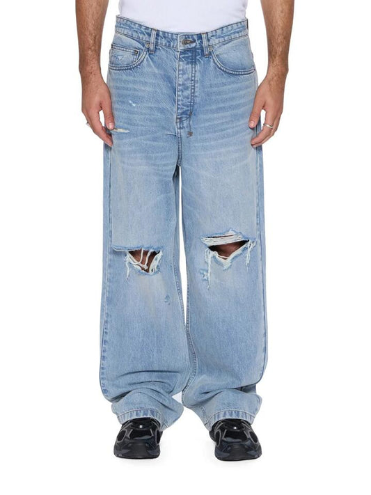 Image of a model wearing Denim. Productname: Ksubi Maxx Striker Jean in THRASHED colour by brand - Ksubi