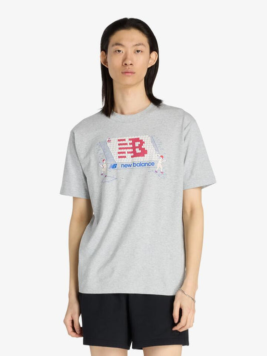 Image of a model wearing Tops. Productname: New Balance New Balance Stands T-Shirt in Athletic Grey colour by brand - New Balance