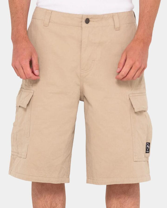 Image of a model wearing Shorts. Productname: Rusty - Mens Commando Cargo Shorts - Stone - in Stone colour by brand - Rusty