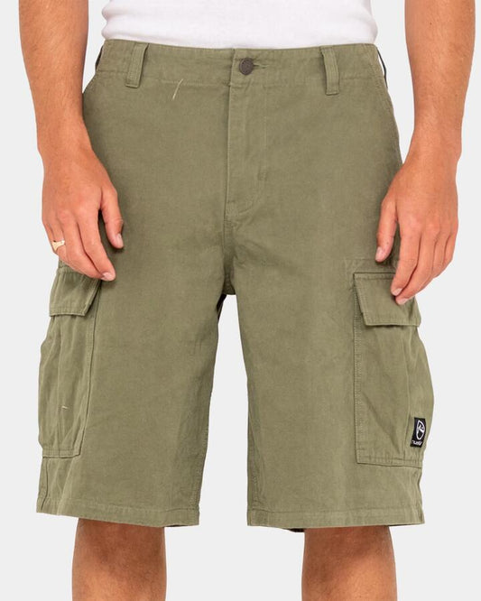 Image of a model wearing Shorts. Productname: Rusty - Mens Commando Cargo Shorts - Army Green - in Army Green colour by brand - Rusty