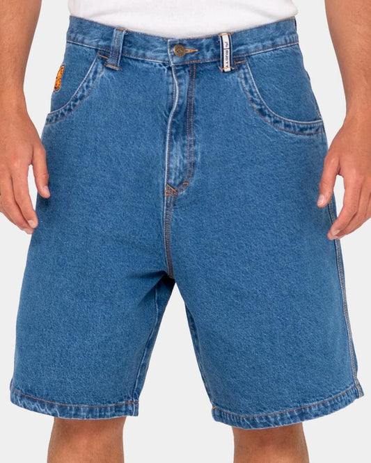 Image of a model wearing Shorts. Productname: Rusty - Mens Flip Daddy Low Ballin Denim Shorts - Middy Blue - in Middy Blue colour by brand - Rusty