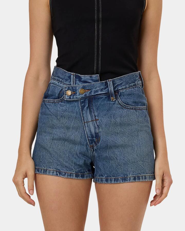 Image of a model wearing Shorts. Productname: Thrills - Womens Kai Wrap Denim Shorts - Blue - in Blue colour by brand - Thrills