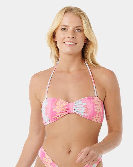 Image of a model wearing Tops. Productname: Rip Curl - Womens Waikiki Keepsakes Bandeau Bikini Top - Pink - in Pink colour by brand - Rip Curl