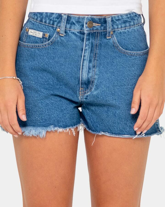 Image of a model wearing Shorts. Productname: Rusty - Womens Penny Kick Flare Denim Shorts - Middy Blue - in Middy Blue colour by brand - Rusty