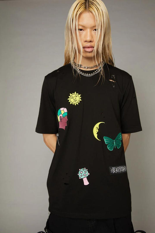Image of a model wearing Tops. Productname: Scrapbook Distressed Tee in Black colour by brand - Black Friday