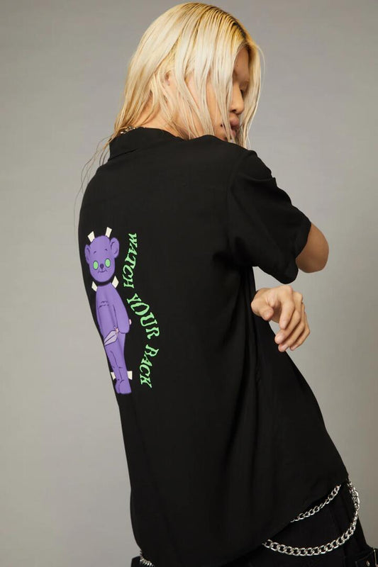 Image of a model wearing Tops. Productname: Watch Your Back SS Shirt in Black colour by brand - Black Friday