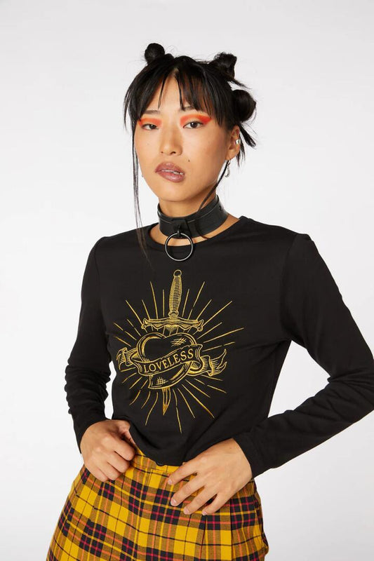 Image of a model wearing Tops. Productname: Golden Heart Crop Top in Black colour by brand - Dangerfield
