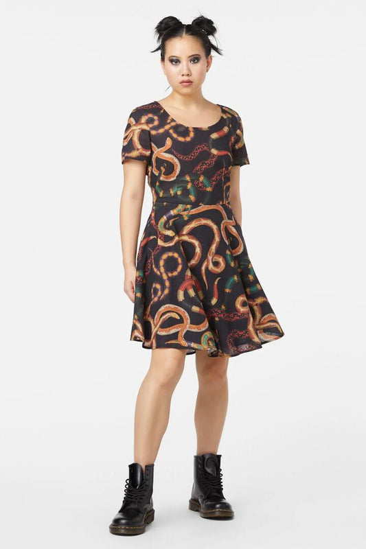 Image of a model wearing Dress. Productname: Serpent Print Cotton Dress in Black colour by brand - Dangerfield