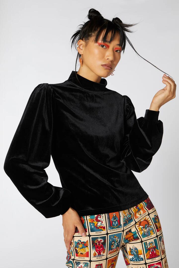 Image of a model wearing Tops. Productname: Balloon Sleeve Velour Top in Black colour by brand - Dangerfield