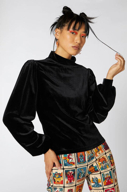 Image of a model wearing Tops. Productname: Balloon Sleeve Velour Top in Black colour by brand - Dangerfield