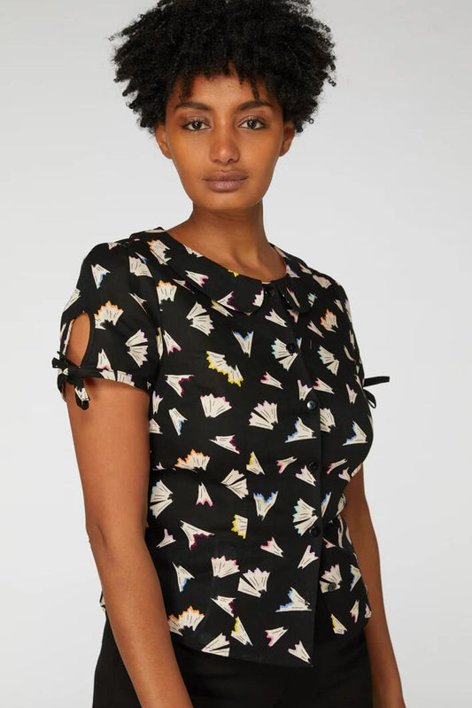 Image of a model wearing Tops. Productname: SharpenYourPencilsBlouse in Black colour by brand - Revival