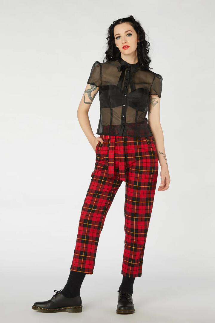 Image of a model wearing Pants. Productname: Walk The Line Pant in Red colour by brand - Revival