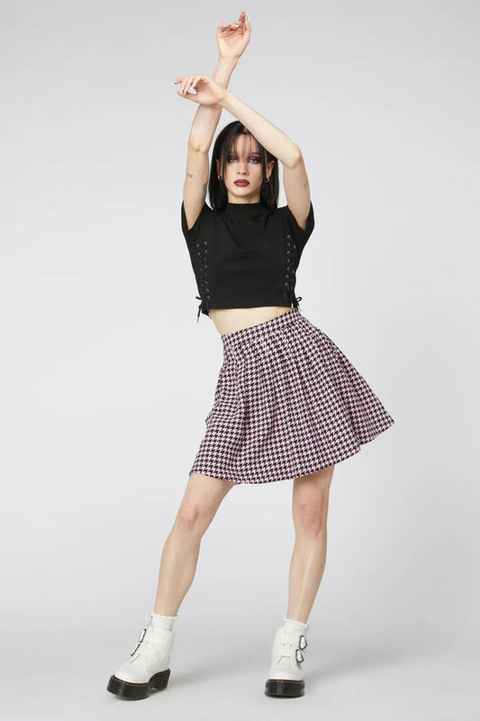 Image of a model wearing Skirts. Productname: Houndstooth Mini Skirt in Pink/Black colour by brand - Revival