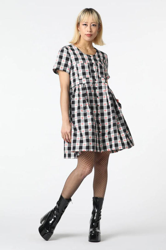 Image of a model wearing Dress. Productname: Gingham Peach Smock Dress in Black/White colour by brand - Revival