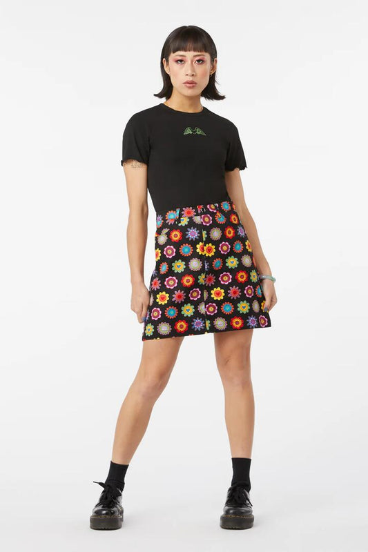Image of a model wearing Skirts. Productname: Daisy Cotton Drill Mini Skirt in Black colour by brand - Dangerfield