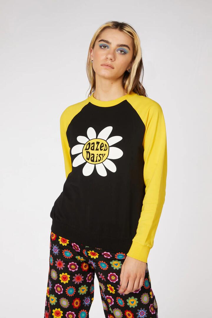 Image of a model wearing Outerwear. Product name - Daisy Raglan Cotton Sweat in Black/Yellow colour by brand - Dangerfield