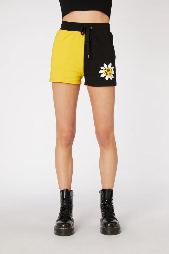 Image of a model wearing Outerwear. Productname: Daisy Cotton Sweat Short in Black/Yellow colour by brand - Dangerfield