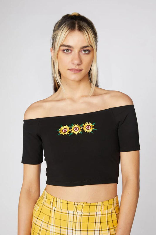 Image of a model wearing Tops. Productname: Sunflower Jersey Crop Top in Black colour by brand - Dangerfield