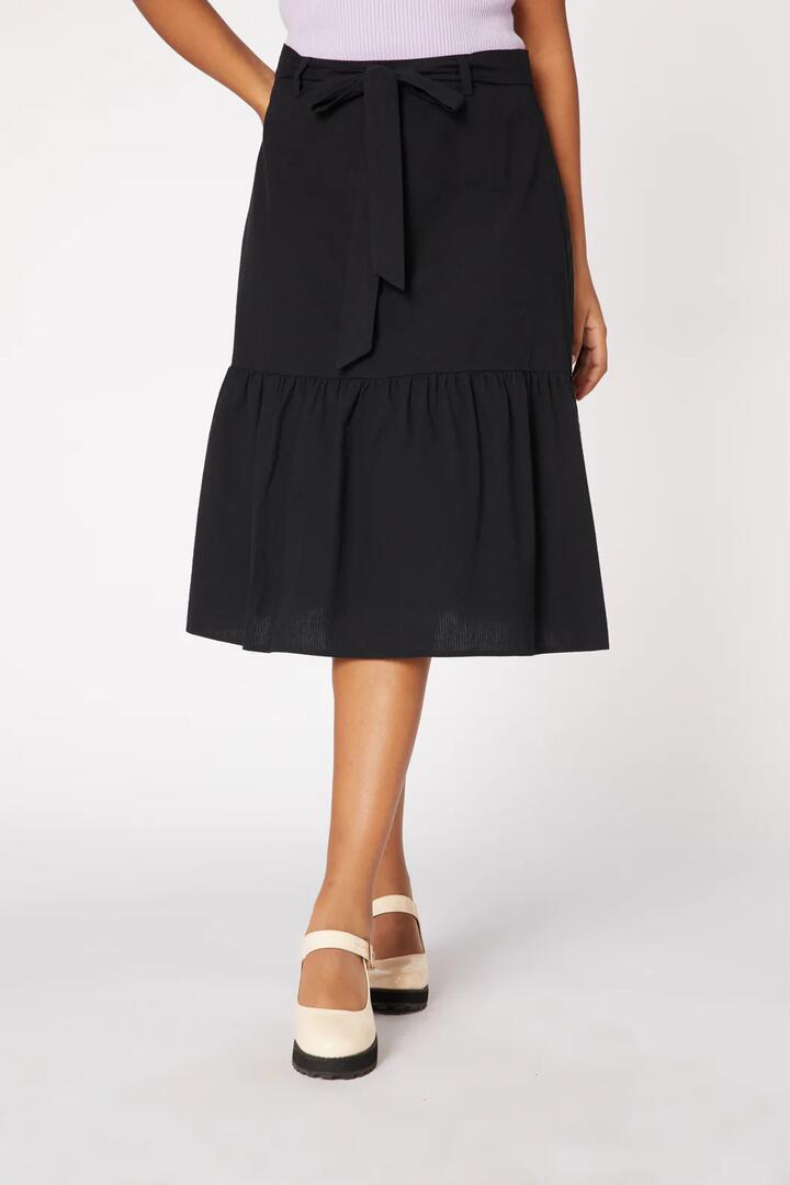Image of a model wearing Skirts. Productname: Josephine Skirt in Black colour by brand - Princess Highway