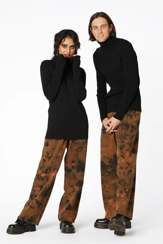 Image of a model wearing Tops. Productname: Danger Unisex Knitted Skivv in Black colour by brand - Dangerfield