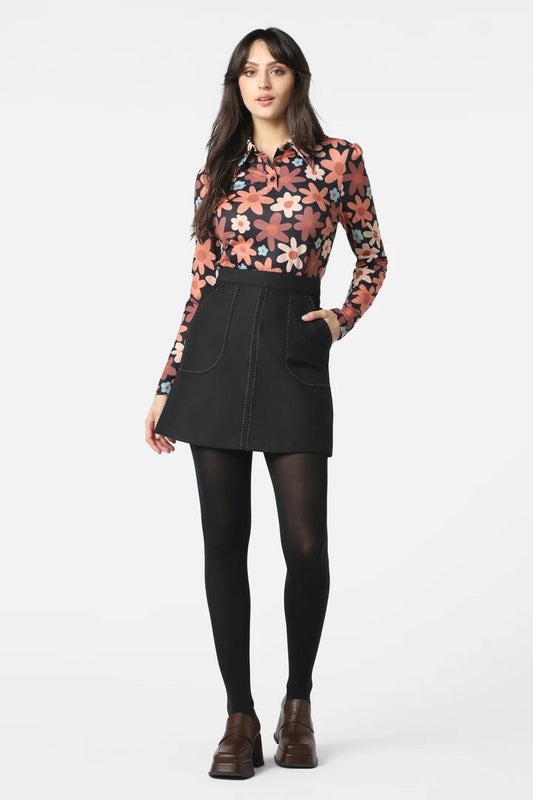 Image of a model wearing Tops. Productname: 60S Daisy Polo Shirt in Black colour by brand - Princess Highway
