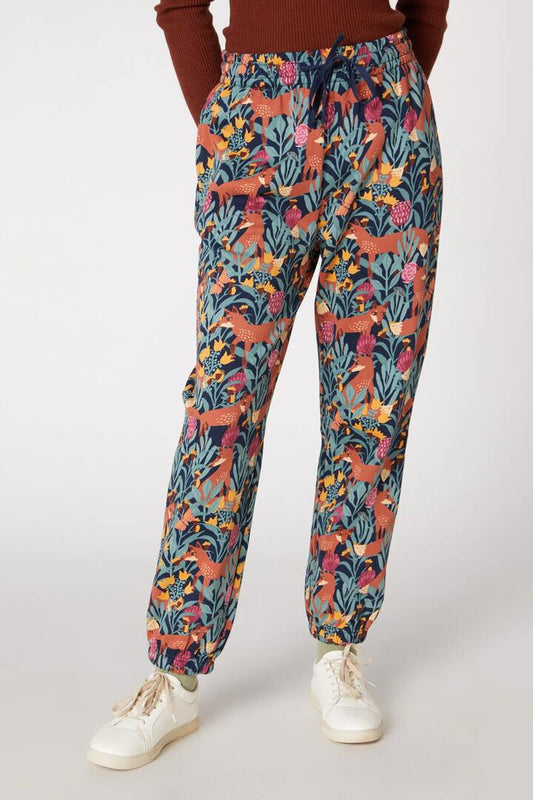 Image of a model wearing Pants. Productname: Foxy Garden Track Pants in Navy colour by brand - Princess Highway