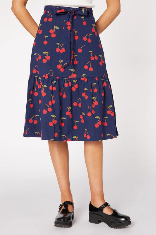 Image of a model wearing Skirts. Productname: Sweet Cherry Skirt in Navy colour by brand - Princess Highway