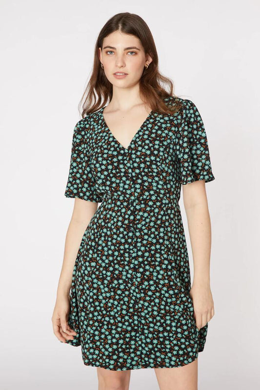 Image of a model wearing Dress. Productname: Elsa Ditsy Mini Dress in Black colour by brand - Princess Highway