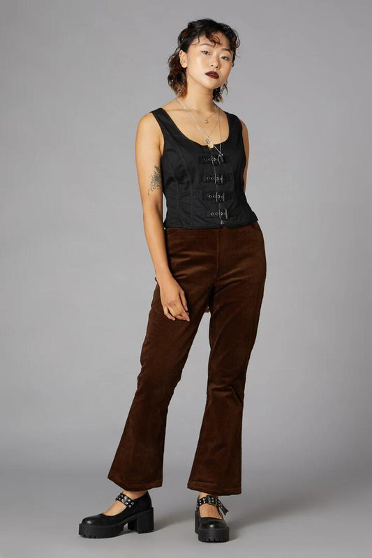 Image of a model wearing Pants. Productname: Bookworm Cord Pant in Brown colour by brand - Black Friday