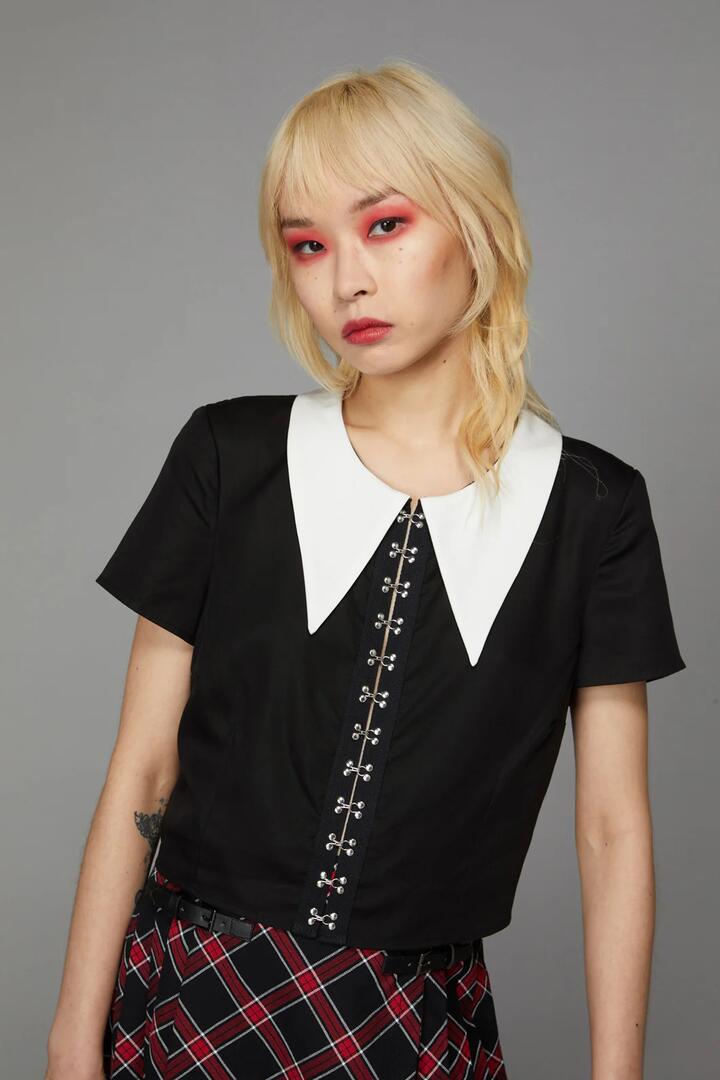 Image of a model wearing Tops. Productname: Wednesday Hook Blouse in Black colour by brand - Black Friday