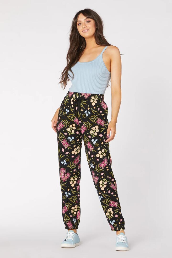 Image of a model wearing Pants. Productname: Bottlebrush Track Pant in Multi colour by brand - Princess Highway