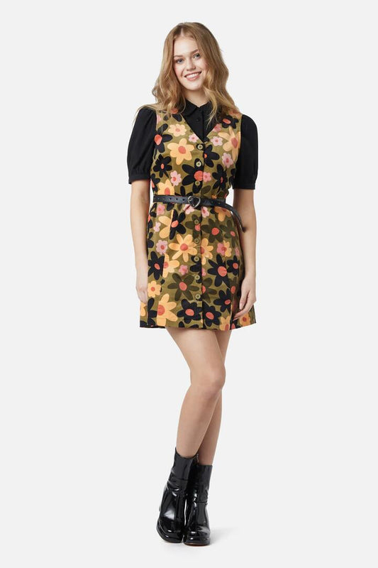 Image of a model wearing Dress. Productname: 60S Daisy Cord Pinny in Black colour by brand - Princess Highway